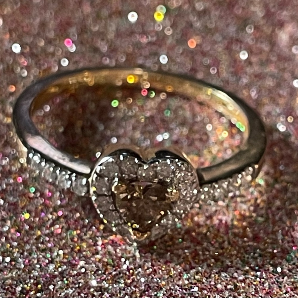 14K gold ring with a heart on It